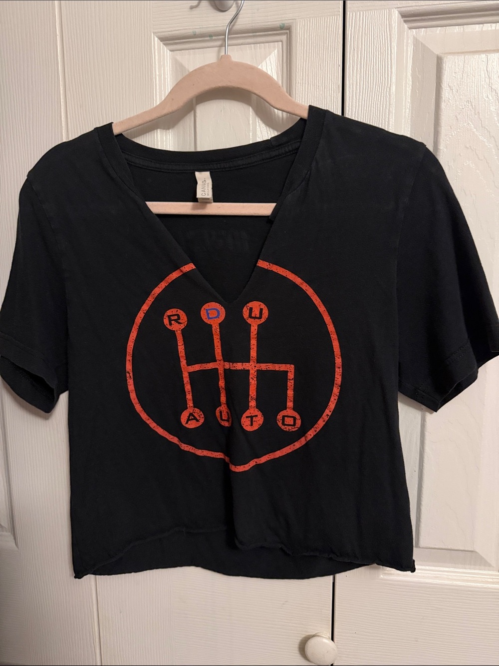 Black V-Neck Graphic Crop Top with Orange Gearshift Print